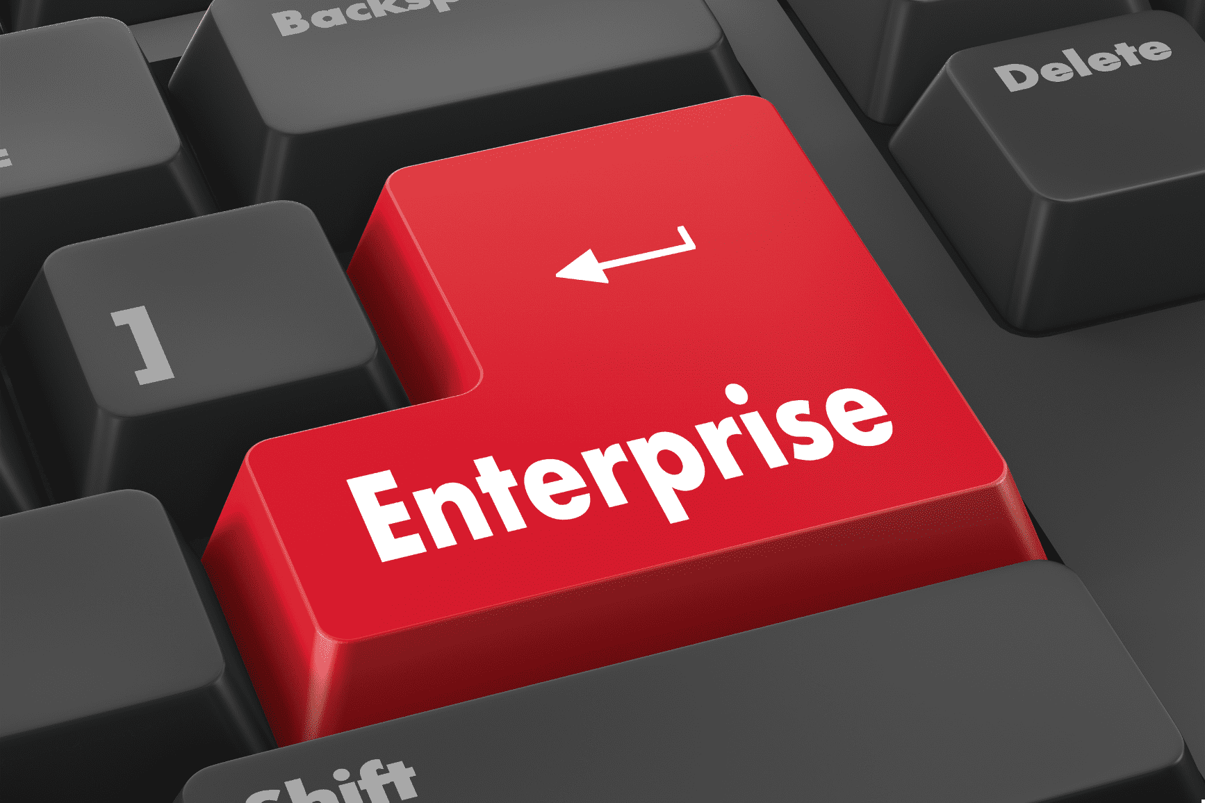Red keyboard key labelled “Enterprise” on a computer keyboard, representing enterprise IT support