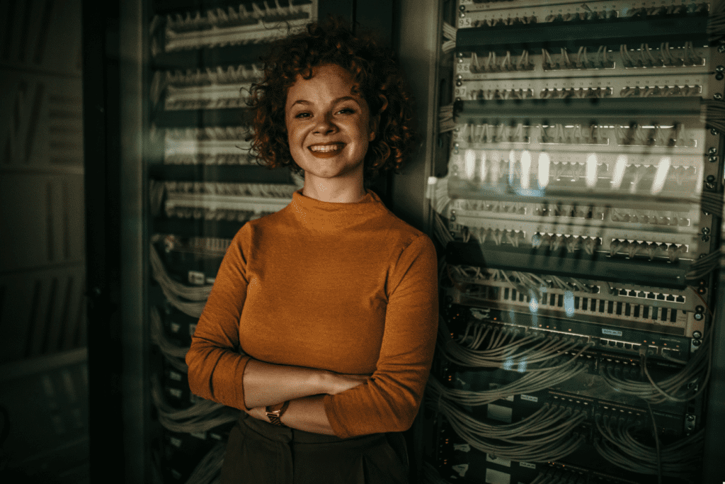 Onsite IT support engineer working in a server room managing business infrastructure