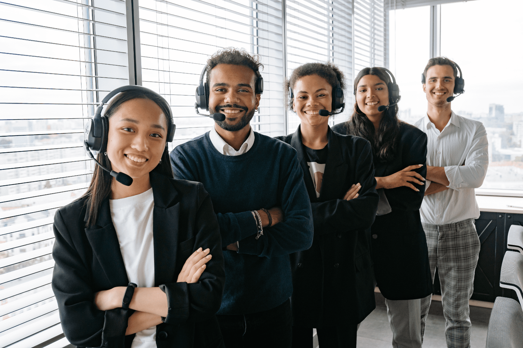 Managed IT support team standing together in a business office